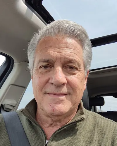Example selfie of a man in his 60s in his car